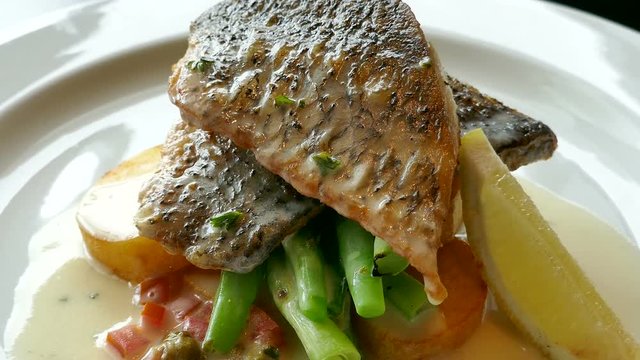 Fish steak with lemon and caper sauce
