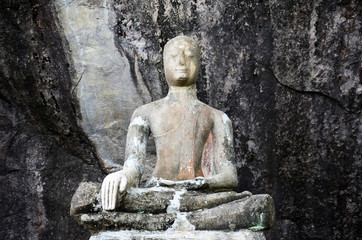 Old broken and ruin buddha statue at Wat Phra Phutthachai in Saraburi, Thailand