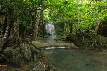 Breathtaking green waterfall at deep forest, Erawan waterfall located Kanchanaburi Province, Thailand