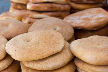 Foto op Canvas loafs of traditionsl khobz bread in bakery in morocco © Nikolai Link