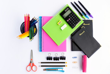 Top view of office supplies and stationery on white background