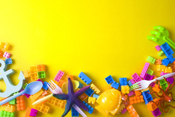 summer colorful prop with brick toy on yellow ground