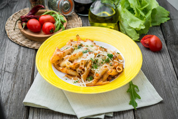 Sausage Spinach Ricotta casserole on wood background