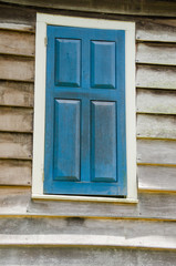 Fototapeta na wymiar blue shuttered window