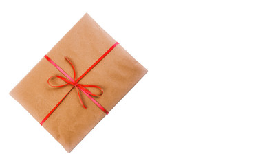 Gift in wrapping paper and bandaged red ribbon isolated on white background with space for text,...