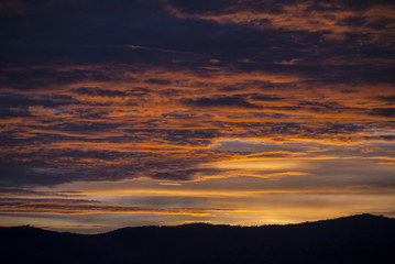 Sunrise clouds and mountains in Guatemala, dramatic sky with striking colors.