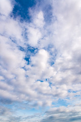 Blue sky with close up white fluffy tiny clouds background and pattern
