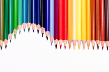 variety of color pencils on white background