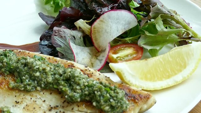 Sea bass steak with sauce
