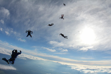 The team of skydivers is in the sky