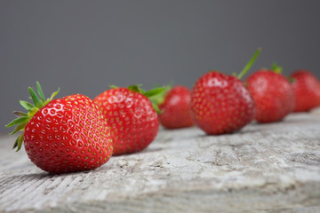 strawberries on the brown wooden table