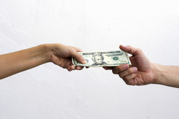 close up of hand giving money dollar note  