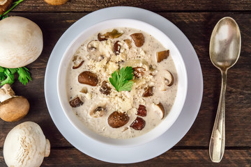 Plate of mushroom soup with champignons, cremini, and parsley