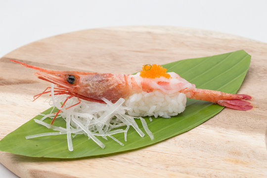 Sweet shrimp sushi on wood tray
