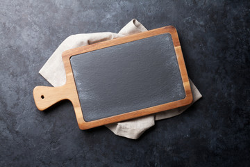 Obraz na płótnie Canvas Cooking utensils on stone table