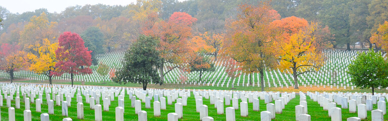 Gravestones in Arlington National Cemetery in autumn foliage - Washington D.C. United States of...