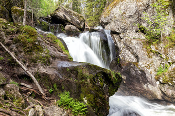 Waterfall on the river Zhigalan. The Kvarkush Range in the North of the Ural Mountains