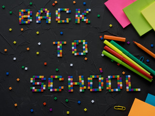 Obraz premium Colorful BACK TO SCHOOL words with part of color pencil tips shown in the frame. Concept of back to school, preparation,routine,sale and discount.