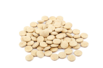 Tablets nutritional supplements vitamins on white background.