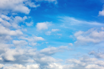 Beautiful blue sky with white fluffy clouds