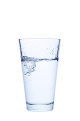 Water pouring in glass isolated on a white