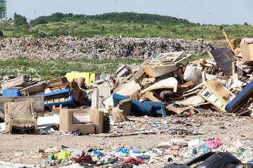 Landfill. Old furniture at the garbage dump.