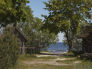 Foot path to Gulf of Riga in Jurmala with wooden old style sheds on each side, Latvia.