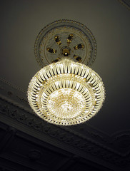 Fototapeta premium Beautiful chandelier weighs on the ceiling
