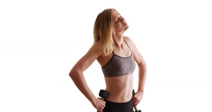Active woman resting after lifting weights on white background with copy space
