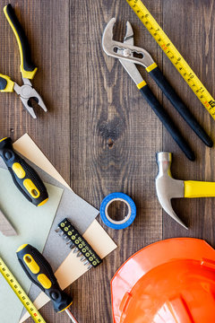Reparing home concept. Tools on wooden desk background top view copyspace