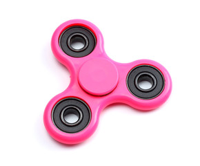 Pink fidget finger spinner toy isolated on white background