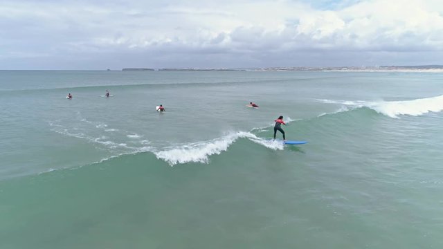 Aerial footage od some people learning how to surf. 4k quality in slowmotion.
