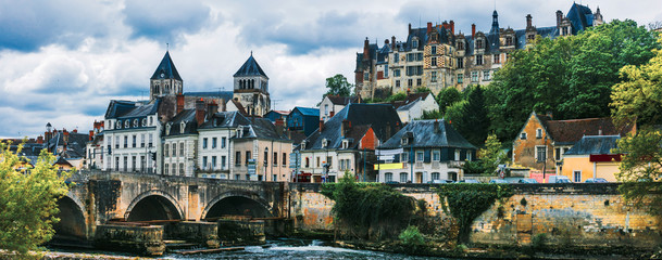 Fototapeta premium Saint-Aignan 11k panorama of medieval town and castle over Cher river in Loire Valley France. Scenic waterfront view of historic stone bridge and church architecture. French riverside travel scenery