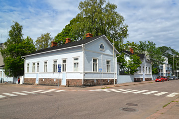 Fototapeta na wymiar Wooden houses on Papinkatu Street. Kotka, Finland