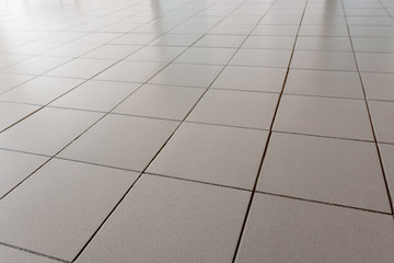 Office floor is lined with gray tiles