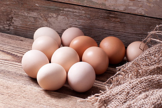 Eggs on old board with burlap