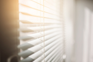 Modern plastic Shutter Jalousie in a room with sunlight
