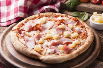Wood Fired Gourmet pizza with a topping of Ham and Pineapple