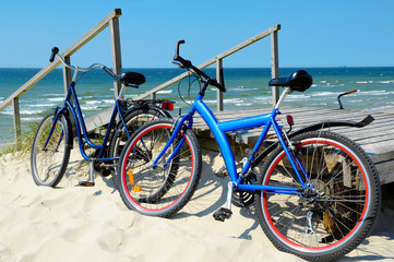 Fototapeta na wymiar Bicycles on a sandy beach
