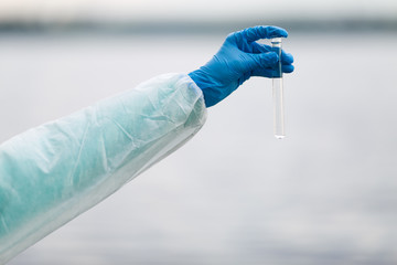 Photo of hand with test-tube