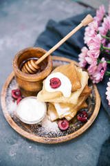 Fresh homemade crepes. Russian pancakes with honey