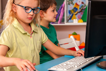Children computer class us for education and video game. Kids in children's club who spend many...