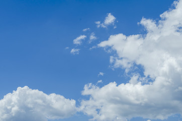 Sunny blue sky background with partial clouds Photo