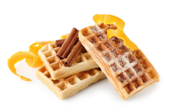 Delicious cinnamon waffles with orange zest isolated on white