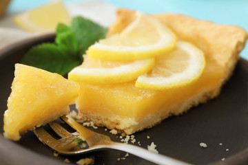 Lemon curd pie with fork on plate