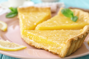 Pieces of lemon pie served on plate