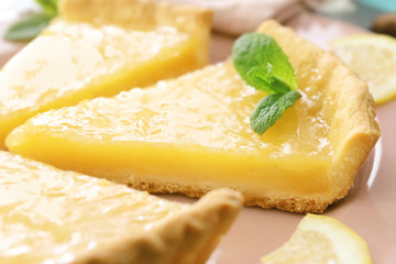 Pieces of lemon pie served on plate