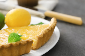 Pieces of homemade lemon tart on plate