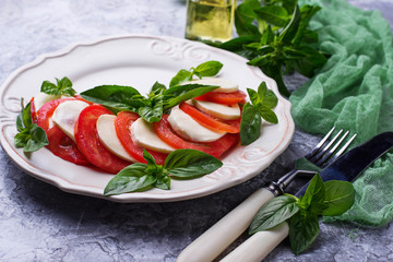 Italian caprese salad with mozzarella, tomatoes and basil