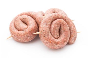 Raw sausages with herbs and spices.